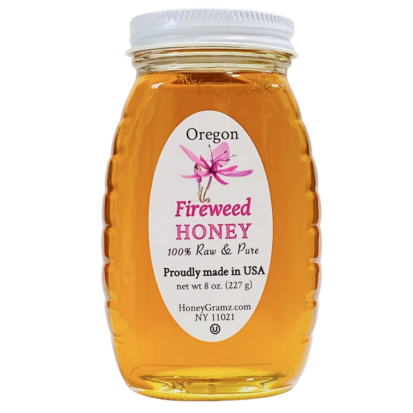A jar of Fireweed Honey with a label indicating it is 100% raw and pure, from Oregon, USA.